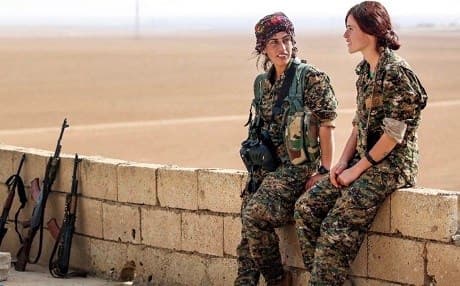 Fighters of the Kurdish Women’s Protection Units (YPJ), one of the brigades partaking in the offensive to retake Raqqa under the SDF flag, rest 40 kilometres outside of Raqqa on Wednesday. Photo: Delil Souleiman/AFP