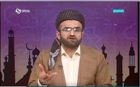 Dr. Wushyar Ismail presents a religious programe on Speda TV on Tuesday, the official satellite channel of the moderate Kurdistan Islamic Union. Photo:screenshot 