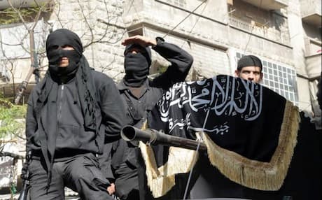 Members of jihadist group Al-Nusra Front take part in a parade calling for the establishment of an Islamic state in Syria. Photo: AFP