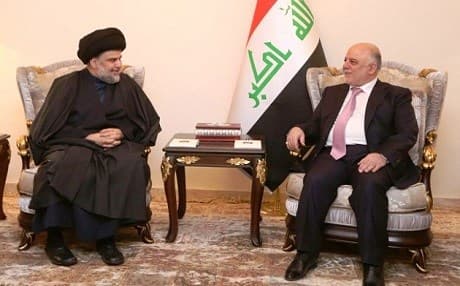 Shiite leader Muqtada al-Sadr [L] met with Prime Minister Haider al-Abadi [R] following tensions between both sides that lasted for at least nine months. Photo: Iraqi PM office. 