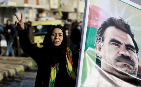 A Syrian Kurdish women holds a portrait of jailed Kurdish leader Abdullah Ocalan during a rally in Qamishli last Monday denoucing that Kursdish reprensantatives were not invited to take part in the upcoming Astana peace talk to be held on Monday. Photo: AFP