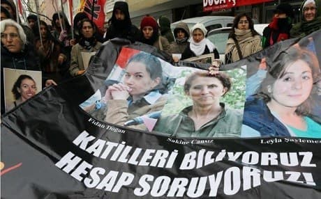 Supporters hold posters of the three PKK women killed in Paris. Photo: AFP/file
