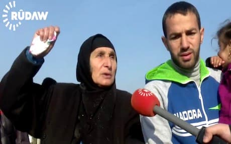 Hajia, the mother of murdered Hamid Khalaf, explains the bitter moment when her son was killed by gunmen in eastern Mosul. Photo: Rudaw video
