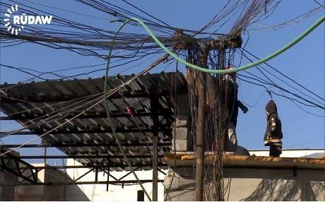 A utility pole in eastern Mosul with dozens of thin and thick power lines which connects the household to private power generators, the only source for electricity in the liberated areas in Mosul. Photo: Rudaw