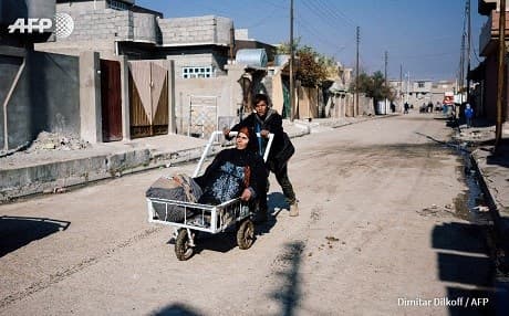 Security concerns are high in east Mosul and a humanitarian crisis in the west. Photo: Dimitar Dilkoff/AFP