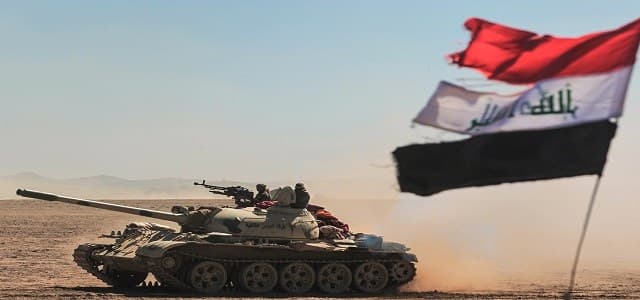 Tanks and armoured vehicles of the Iraqi forces, supported by the Hashed al-Shaabi  paramilitaries, advance towards the village of Sheikh Younis, south of Mosul on Sunday. Photo:AFP
