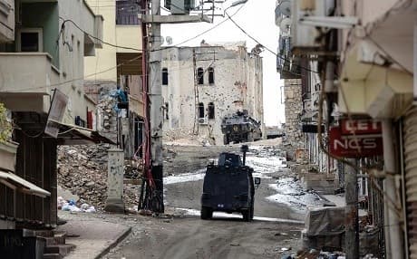 Turkish military vehicles in deserted Silvan during a curfew as the Turkish army clashed with Kurdish guerrillas in November 2015. Photo: Ilyas Akengin/AFP 
