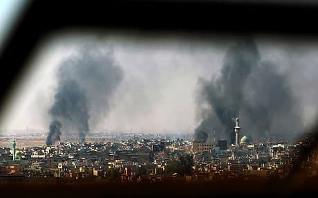 Smoke rises into the sky of Mosul on Friday as the Iraqi forces are increasingly taking ground against the ISIS militants in western Mosul. Photo: AFP/Ahmad al-Rubaye