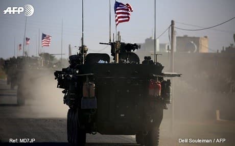 US forces stepped up their visible presence in northern Syria around Manbij earlier this month. Images show the US forces moving in the Manbij area, flying American flags. Photo: Delil Souleiman/AFP