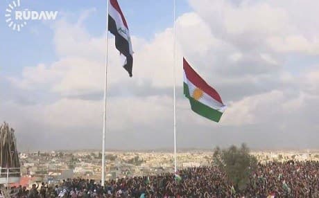 The Kurdish flag being raised in Kirkuk on Monday. Photo: Rudaw video