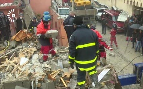 Crews search the rubble of a collapsed building in west Mosul, looking for casualties. Photo: Rudaw video