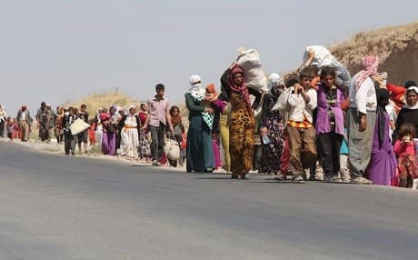 Two and a half years after ISIS attacked Shingal, more than 75 percent of Yezidis remain displaced. Here Yezidi families are pictured fleeing Shingal in 2014. Photo: AFP