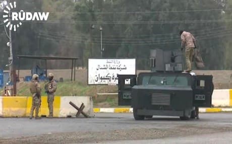 A Patriotic Union of Kurdistan (PUK) force stationed on the doorsteps of North Oil Company in Kirkuk. Photo: Rudaw