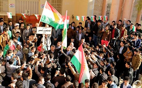 People wave the flag of the Kurdistan Region. Photo: Rudaw
