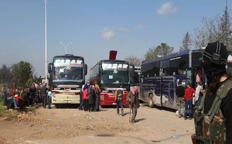 Syrians wait in rebel-held Rashidin, west of Aleppo city, following delays in evacuating them, on April 15, 2017. AFP photo