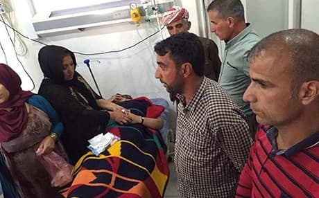Relatives visit Nergiz Hussein, injured in a Turkish aerial attack, in a hospital in Duhok. Photo: Rudaw 