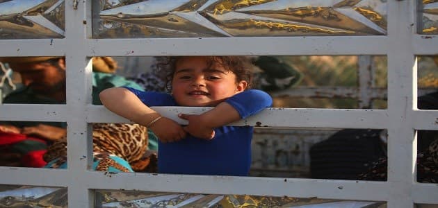 A Syrian child displaced due to the fighting between the US-backed Syrian Democratic Forces and the ISIS militants around the ISIS-held Raqqa city in late April. Photo: AFP/Delil Souleiman