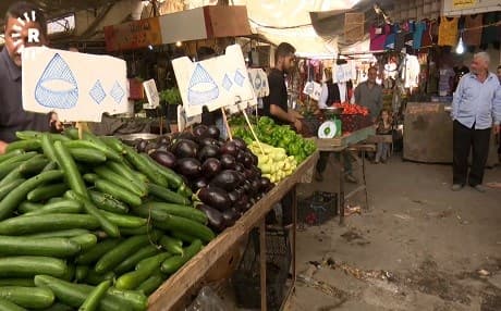 Food items for sale in the Nabi Younis market in eastern Mosul on Thursday. It reads cucumber and aubergine for 500 Iraqi dinars, about 40 cents. Photo: Rudaw video