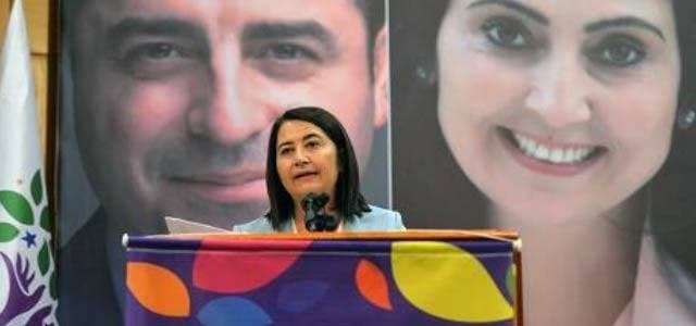 Serpil Kemalbay, speaks in front of the banner of the jailed HDP's co-leaders Figen Yuksekdag and Selahattin Demirtas, after she has been elected as the party's new co-leader on Saturday in Ankara. Photo: AFP/STR
