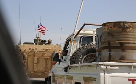 US armored vehicles lead a convoy of vehicles with Kurdish fighters in northern Syria in early May. Photo: Rudaw