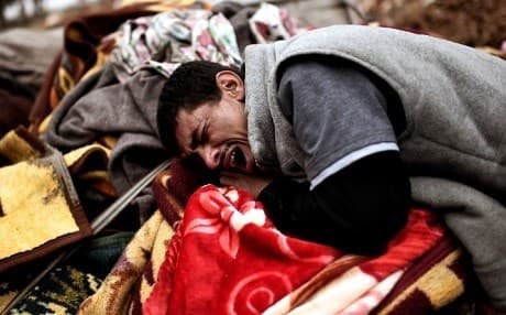 A man cries over the body of family member killed in an airstrike in west Mosul on March 17. Photo: Aris Messinis/AFP