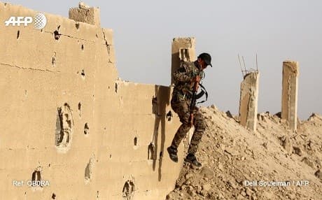 An SDF fighter near Raqqa. Photo: Delil Souleiman/AFP