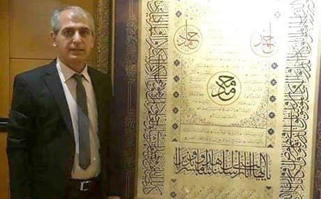 Ali Hassan Zaman with his calligraphy. Photo: Courtesy of Ali Hassan Zaman