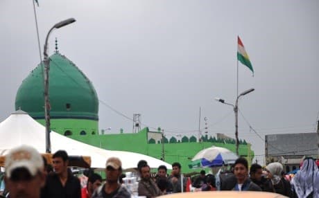 Flag of Kurdistan fly high in the city center of Kirkuk. The Baathi-era name of Taamim means nationalization after the nationalization of the Iraqi oil in early 1970s.  Rudaw file photo.