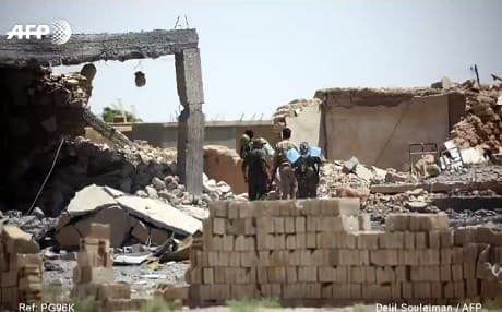 Syrian Democratic Forces enter destroyed Raqqa city in early June 2017. Photo: Delil Souleman | AFP