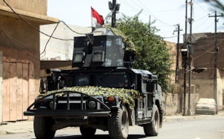 An Iraqi forces' humvee advances through the Old City of Mosul on June 26, 2017, as the offensive continues to retake the last district held by ISIS. Photo:  AFP / Ahmad Al-Rubaye