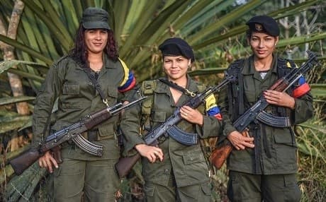 Members of the Revolutionary Armed Forces of Colombia (FARC) pose at a camp in the country's mountains. Photo: Luis Acosta | AFP