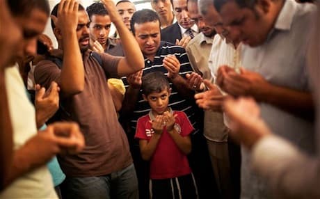 Members and supporters of the Muslim Brotherhood at the funeral of the son of Mohammad Badie, the group's leader, killed by the Egyptian military in August 2013. Photo: AP