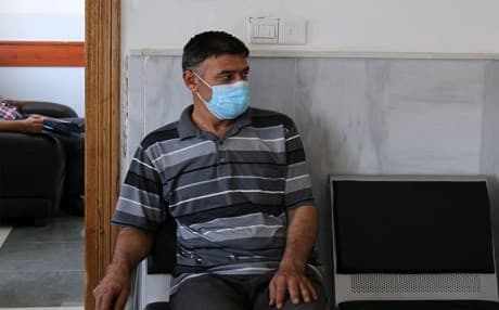 A patient transported by IOM waits to be screened for TB at a National Tuberculosis Program Center in Erbil. Photo: Sarah Ali Abed / UN Migration Agency (IOM) 2017