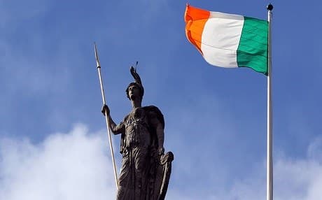 The flag of Ireland flaps in the wind over the post office in Dublin, Ireland. Photo: AFP