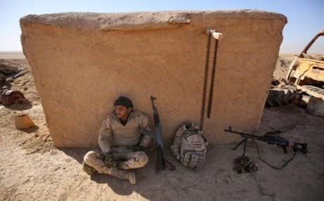 A Shiite Hashd al-Shaabi fighter rests in al-Tofaha southeast of Tal Afar city. Photo: Ahmad Al-Rubaye | AFP