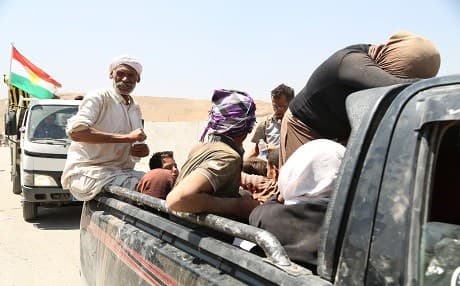 Yezidis headed for the Kurdistan Region during the ISIS invasion of the Shingal region in August 2014. Photo: Rudaw