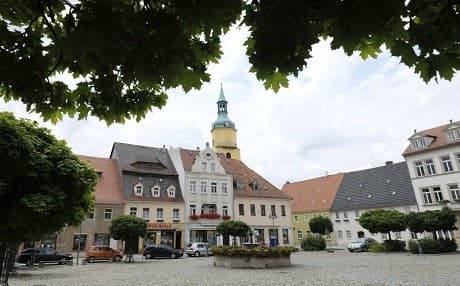 The market place of Pulsnitz photographed on Saturday, July 22, 2017. A German girl, who ran away from home shortly after converting to Islam, has been found in Iraq, prosecutors said Saturday. The 16-year-old teenager, only identified as Linda W. is getting consular assistance from the German Embassy in Iraq, said prosecutor Lorenz Haase from the eastern German city of Dresden. Haase wouldn’t confirm media reports that the teenager from Pulsnitz in eastern Germany had been fighting for the Islamic State group in Mosul. (Sebastian Willnow/dpa via AP)