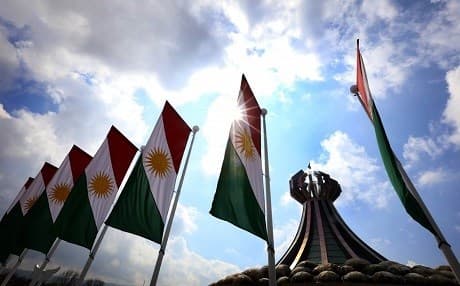 The flags of Kurdistan flutter near Halabja monument to the Kurdish victims of the chemical attack that killed thousands of people, and injured many more on March 16, 1988 at the hands of the Iraqi regime. File photo: Safin Hamid/AFP/Getty Images. 