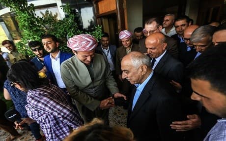 Gorran's newly elected leader Omar Ali [R] and Adham Barzani, from the Kurdistan Democratic Party, shake hands as a KDP delegation visited Gorran's headquarters in Sulaimani to congratulate Ali's election as party's leader in July 2017. File photo:Rudaw/Sartip Othman