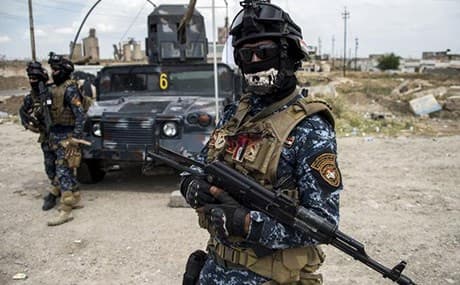 Members of the Emergency Response Division man a checkpoint in west Mosul in May. Photo: Fadel Senna/AFP