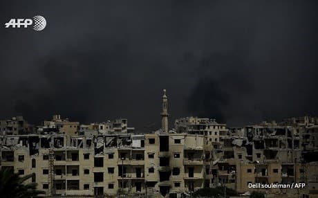Smoke fills the skies over Raqqa's al-Darya neighbnorhood on Monday. Photo: Delil Souleiman | AFP