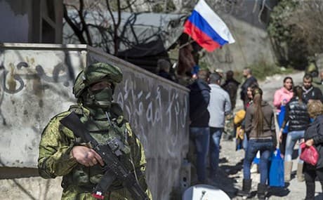 A Russian soldier stands guard in a Syrian village. File photo: Pavel Golovkin/AP