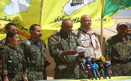 Ahmad Abu Khawlah (3rd-R), chief of the Deir ez-Zor Military Council -- a coalition of Arab tribes and fighters that belongs to the broader US-backed Syrian Democratic Forces -- speaks during a press conference in the northeastern Syrian village of Abu Fas, on the southern outskirts of Hasakah province, on September 9, 2017. Photo: AFP / Delil Souleiman 