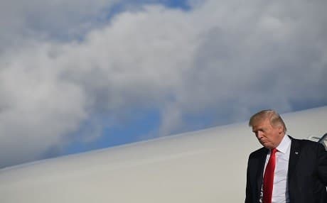US President Donald Trump looks down after getting off Air Force One in Bedminster, New Jersey on September 15, 2017. Photo: AFP / Mandel Ngan