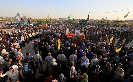 Mourners gather in Qamishli for the funeral of fighters from the Syrian Democratic Forces that were killed in combat against ISIS in Raqqa on September 13. Photo: Delil Souleiman | AFP