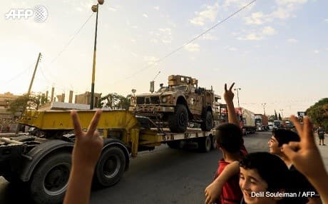 A convoy of US-made weapons arrive in Qamishli, Rojava, Syria destined for the SDF on Tuesday. Photo: Delil Souleiman/AFP