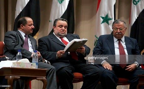 Masoud Barzani of the Kurdistan Democratic Party, Hajim al-Hassani, a Sunni politician of the Iraqi Islamic Party, and Jalal Talabani of the Patriotic Union of Kurdistan sit for a Transitional National Assembly meeting in Baghdad in October 12, 2005. Photo: Mohamed Mesara | AFP via Getty