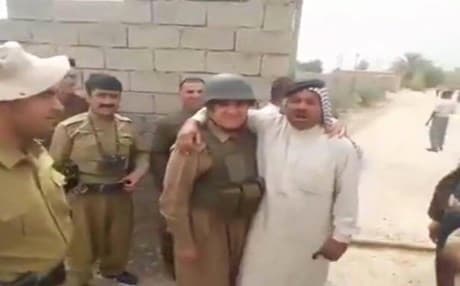 The screenshot of a video shared on social media showing Sheikh Adnan while embracing a Peshmerga. 