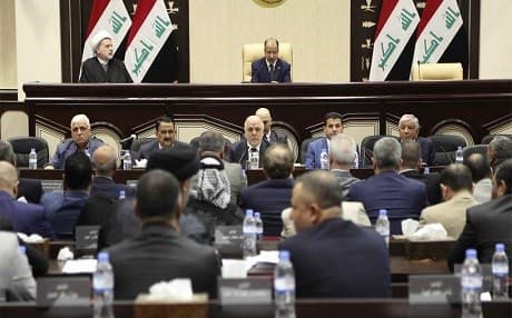 Iraqi Prime Minister Haider Al Abadi [centre]  attends a session of the Iraqi parliament in Baghdad on September 27, 2017 when they passed a set of measures against the Kurdish independence vote held by Erbil. Photo Karim Kadim / AP