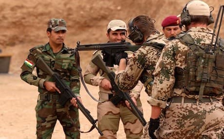 German military experts instruct Kurdish Peshmerga fighters during training at a shooting range in Erbil, October, 2014. Photo: AFP